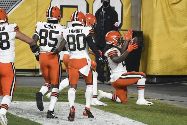 Cleveland Browns running back Kareem Hunt (27) celebrates after scoring on an eight-yard run during the first half of an NFL wild-card playoff football game against the Pittsburgh Steelers in Pittsburgh, Sunday, Jan. 10, 2021. (AP Photo/Don Wright)