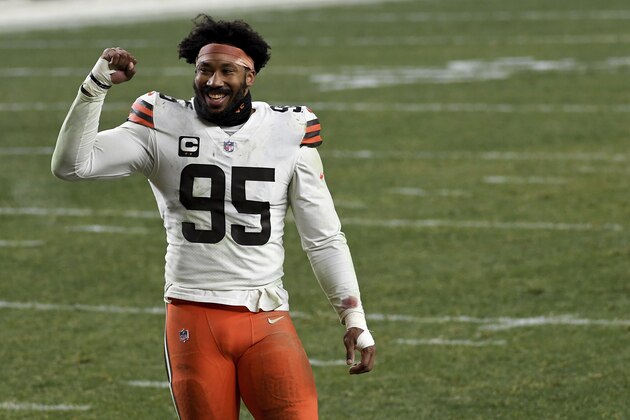 Cleveland Browns defensive end Myles Garrett (95) reacts as he walks off the field after defeating the Pittsburgh Steelers 48-37 during an NFL wild-card playoff football game, Sunday, Jan. 10, 2021, in Pittsburgh. (AP Photo/Justin Berl)