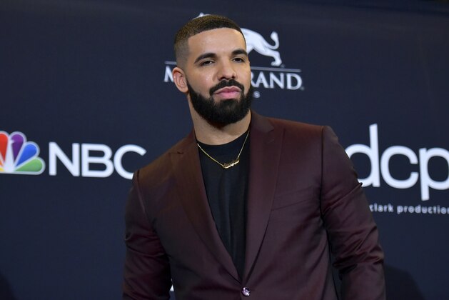 FILE - This May 1, 2019 file photo shows Drake at the Billboard Music Awards in Las Vegas. Earning his 21st No. 1 hit on Billboard's R&B/Hip-Hop songs chart, Drake has bested a record previously held by icons Aretha Franklin and Stevie Wonder. Drake's â€œLaugh Now Cry Later,