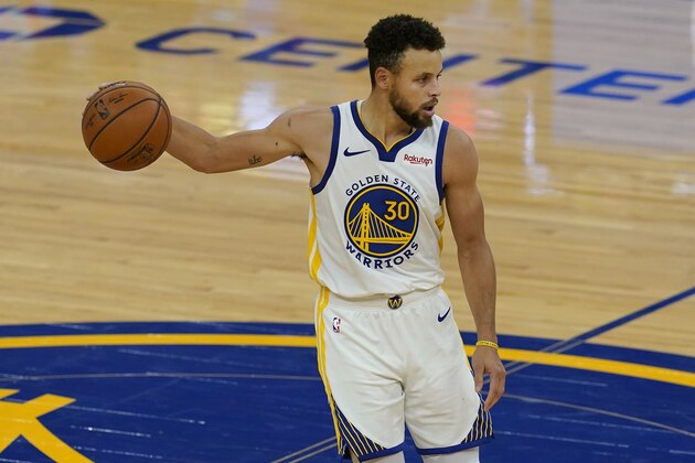 Golden State Warriors guard Stephen Curry (30) dribbles against the Toronto Raptors during the second half of an NBA basketball game in San Francisco, Sunday, Jan. 10, 2021. (AP Photo/Jeff Chiu)
