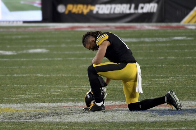 Pittsburgh Steelers wide receiver Chase Claypool (11) kneels at midfield following a 48-37 loss to the Cleveland Browns during an NFL wild-card playoff football game, Sunday, Jan. 10, 2021, in Pittsburgh. (AP Photo/Justin Berl)
