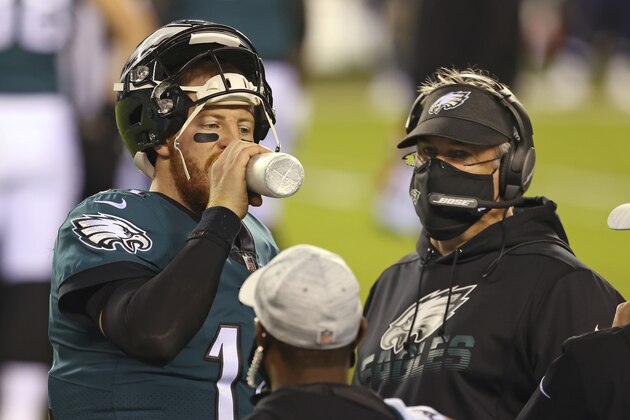 Philadelphia Eagles' Carson Wentz (11) and head coach Doug Pederson during an NFL football game against the Seattle Seahawks, Monday, Nov. 30, 2020, in Philadelphia. The Seahawks defeated the Eagles (AP Photo/Rich Schultz)