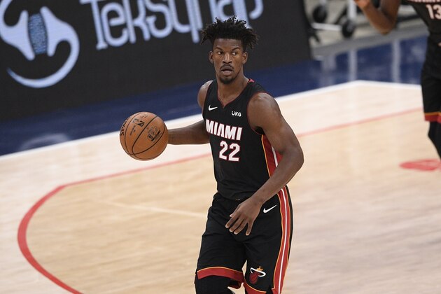 Miami Heat forward Jimmy Butler (22) dribbles the ball during the second half of an NBA basketball game against the Washington Wizards, Saturday, Jan. 9, 2021, in Washington. (AP Photo/Nick Wass)