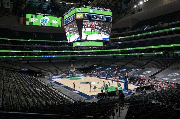 The Orlando Magic and the Dallas Mavericks play in an otherwise empty American Airlines Center during the first half of an NBA basketball game, Saturday, Jan. 9, 2021, in Dallas. (AP Photo/Jeffrey McWhorter)