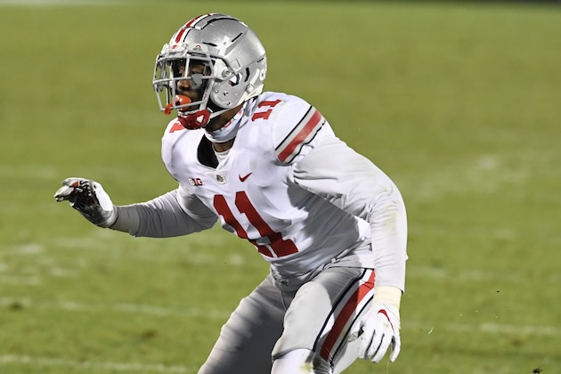 Ohio State defensive end Tyreke Smith (11) rushes against Penn State during an NCAA college football game in State College, Pa., on Saturday, Oct. 31, 2020. Ohio State defeated Penn State 38-25. (AP Photo/Barry Reeger)