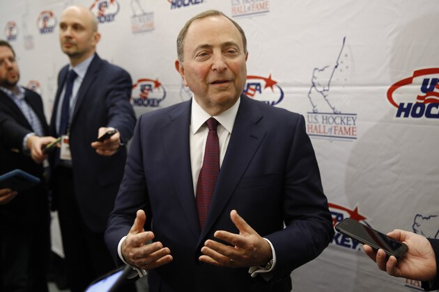 NHL Commissioner Gary Bettman speaks with members of the media before being inducted into the U.S. Hockey Hall of Fame, Thursday, Dec. 12, 2019, in Washington. (AP Photo/Patrick Semansky)
