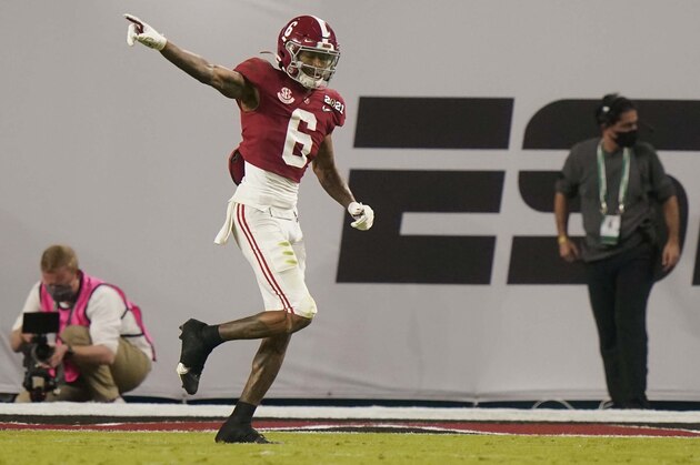 Alabama wide receiver DeVonta Smith celebrates after scoring against Ohio State during the first half of an NCAA College Football Playoff national championship game, Monday, Jan. 11, 2021, in Miami Gardens, Fla. (AP Photo/Lynne Sladky)