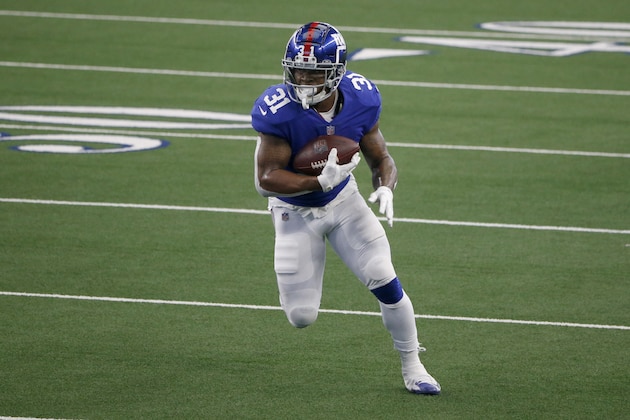 New York Giants running back Devonta Freeman (31) runs against the Dallas Cowboys during the first half of an NFL Football game in Arlington, Texas, Sunday, Oct. 11, 2020. (AP Photo/Michael Ainsworth)