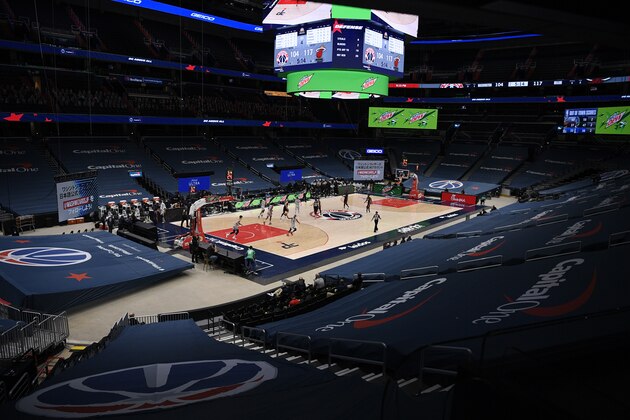 The Washington Wizards and the Miami Heat compete in a mostly empty arena during the second half of an NBA basketball game, Saturday, Jan. 9, 2021, in Washington. The Heat won 128-124. (AP Photo/Nick Wass)