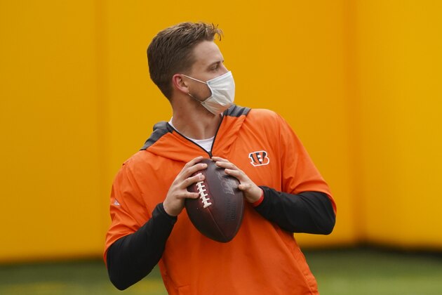 Cincinnati Bengals quarterback Joe Burrow (9) preparing to throw the ball during pregame before the start of an NFL football game against the Washington Football Team, Sunday, Nov. 22, 2020, in Landover, Md. (AP Photo/Andrew Harnik)