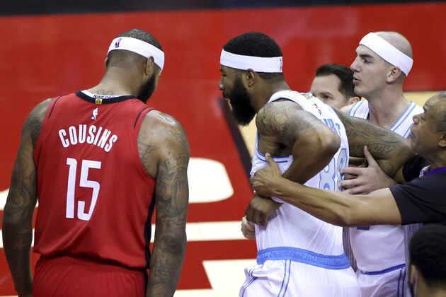 Markieff Morris, right, of the Los Angeles Lakers, reacts towards DeMarcus Cousins, left, of the Houston Rockets before being ejected during the first quarter of an NBA basketball game Sunday, Jan. 10, 2021, in Houston, Texas. (Carmen Mandato/Pool Photo via AP)