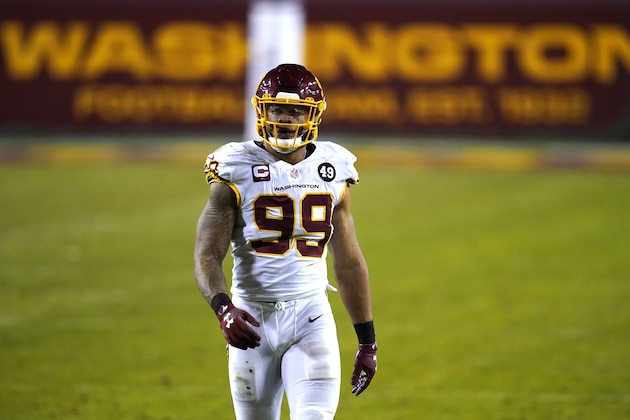 Washington Football Team defensive end Chase Young looks on during the second half of an NFL wild-card playoff football game against the Tampa Bay Buccaneers, Saturday, Jan. 9, 2021, in Landover, Md. Tampa Bay won 31-23. (AP Photo/Julio Cortez)