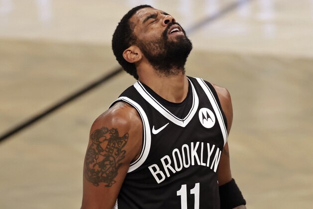 Brooklyn Nets guard Kyrie Irving reacts to missing a shot during the second half of the team's NBA basketball game against the Atlanta Hawks, Friday, Jan. 1, 2021, in New York. (AP Photo/Adam Hunger)