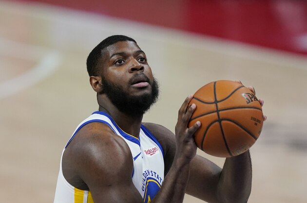 Golden State Warriors forward Eric Paschall shoots a free throw during the first half of an NBA basketball game, Tuesday, Dec. 29, 2020, in Detroit. (AP Photo/Carlos Osorio)