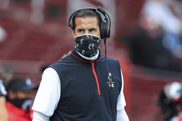 Cincinnati head coach Luke Fickell works the sideline during an NCAA college football game against South Florida, Saturday, Oct. 3, 2020, in Cincinnati. No. 8 Cincinnati's game at Tulsa on Saturday has been postponed because of positive COVID-19 tests among Bearcats players. The American Athletic Conference announced Thursday, Oct. 15, the game is being rescheduled for Dec. 5. (AP Photo/Aaron Doster, File)