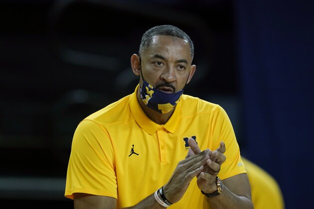 Michigan coach Juwan Howard watches from the sideline during the first half of the team's NCAA college basketball game against Wisconsin, Tuesday, Jan. 12, 2021, in Ann Arbor, Mich. (AP Photo/Carlos Osorio)