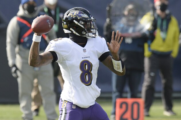 Baltimore Ravens quarterback Lamar Jackson (8) passes against the Tennessee Titans in the first half of an NFL wild-card playoff football game Sunday, Jan. 10, 2021, in Nashville, Tenn. (AP Photo/Mark Zaleski)