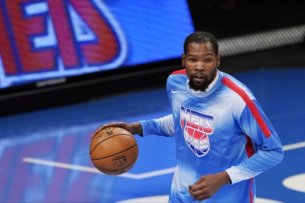 Brooklyn Nets forward Kevin Durant dribbles the ball during during pregame warmups before an NBA basketball game against the Oklahoma City Thunder, Sunday, Jan. 10, 2021, in New York. (AP Photo/Kathy Willens)