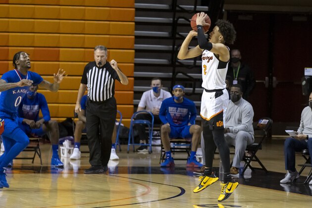 Oklahoma State's Cade Cunningham shoots a 3-point basket during the first half of the team's NCAA college basketball game against Kansas in Stillwater, Okla., Tuesday, Jan. 12, 2021. (AP Photo/Mitch Alcala)