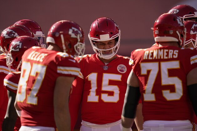Kansas City Chiefs quarterback Patrick Mahomes (15) talks with teammates in the huddle during the first half of an NFL football game against the Atlanta Falcons Sunday, Dec. 27, 2020, in Kansas City, Mo. (AP Photo/Jeff Roberson)