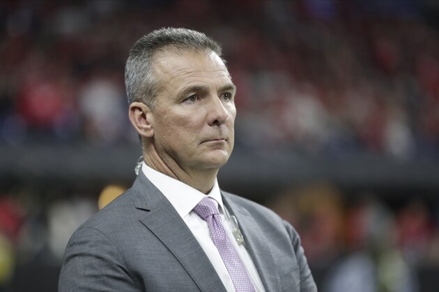 Former Ohio State head coach Urban Meyer watches during the second half of the Big Ten championship NCAA college football game between Ohio State and Wisconsin, Saturday, Dec. 7, 2019, in Indianapolis. (AP Photo/Michael Conroy)