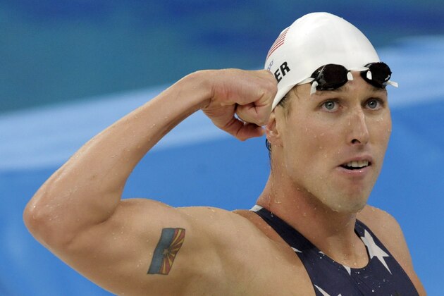 FILE - In this  Tuesday, Aug. 12, 2008 file photo, United States' relay swimmer Klete Keller reacts after a men's 4x200-meter freestyle relay heat during the swimming competitions in the National Aquatics Center at the Beijing 2008 Olympics in Beijing. Five-time Olympic swimming medalist Klete Keller was charged Wednesday, Jan. 13, 2021  with participating in a deadly riot at the U.S. Capitol after video emerged that appeared to show him among those storming the building last week. (AP Photo/Thomas Kienzle, File)