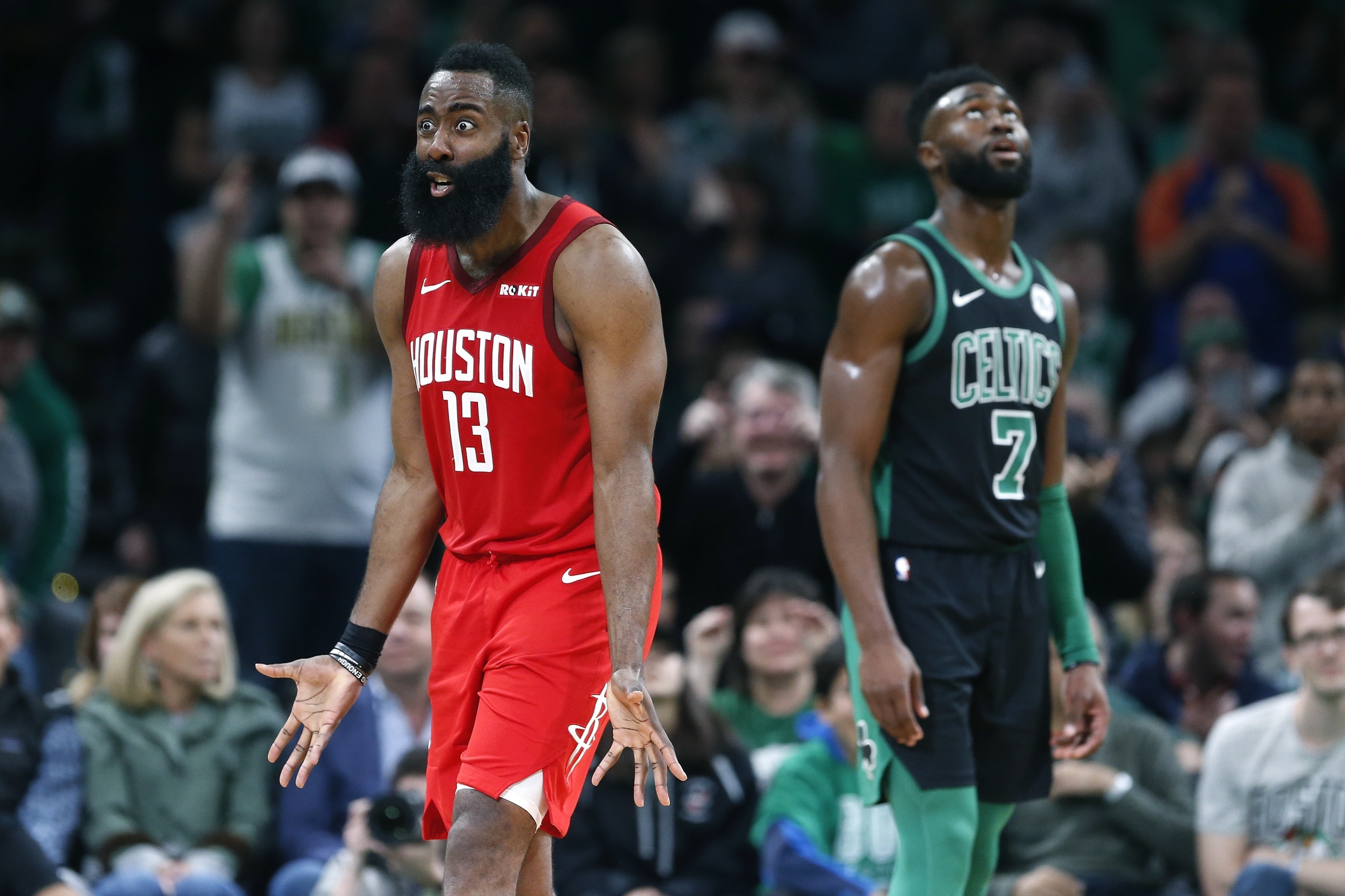 Houston Rockets' James Harden (13) protests beside Boston Celtics' Jaylen Brown (7) after being called on a foul during the second half of an NBA basketball game in Boston, Sunday, March 3, 2019. (AP Photo/Michael Dwyer)