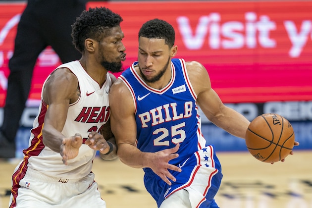 Philadelphia 76ers' Ben Simmons, right, drives against Miami Heat's Chris Silva, left, during the first half of an NBA basketball game Tuesday, Jan. 12, 2021, in Philadelphia. (AP Photo/Chris Szagola)