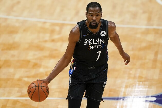 Brooklyn Nets forward Kevin Durant brings the ball down court against the Charlotte Hornets during the first half of an NBA basketball game in Charlotte, N.C., Sunday, Dec. 27, 2020. (AP Photo/Chris Carlson)