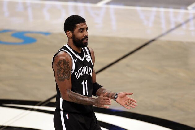 Brooklyn Nets guard Kyrie Irving (11) reacts during an NBA basketball game against the Atlanta Hawks, Friday, Jan. 1, 2021, in New York. The Hawks won 114-96. (AP Photo/Adam Hunger)