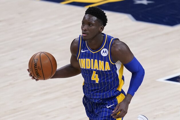 Indiana Pacers' Victor Oladipo (4) dribbles during the second half of an NBA basketball game against the Phoenix Suns, Saturday, Jan. 9, 2021, in Indianapolis. (AP Photo/Darron Cummings)