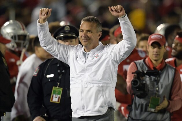 FILE - In this Tuesday, Jan. 1, 2019 file photo, Ohio State coach Urban Meyer celebrates at the end of the team's 28-23 win over Washington during the Rose Bowl NCAA college football game in Pasadena, Calif. Urban Meyer is headed back to television. Fox announced on Monday, March 11, 2019 that they have hired the former Ohio State coach as one of the analysts for its retooled college football pregame show. Fox also announced that it has hired Reggie Bush and will move Brady Quinn from the booth to the studio. (AP Photo/Mark J. Terrill, File)