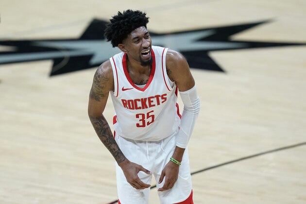 Houston Rockets center Christian Wood (35) reacts after a play during the first half of an NBA basketball game against the San Antonio Spurs in San Antonio, Thursday, Jan. 14, 2021. (AP Photo/Eric Gay)
