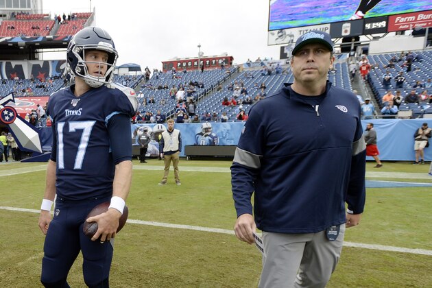 Tennessee Titans quarterback Ryan Tannehill (17) talks with offensive coordinator Arthur Smith before an NFL football game against the Tampa Bay Buccaneers Sunday, Oct. 27, 2019, in Nashville, Tenn. (AP Photo/Mark Zaleski)