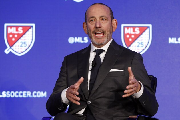 FILE - In this Feb. 26, 2020, file photo, Major League Soccer Commissioner Don Garber speaks during the Major League Soccer 25th Season kickoff event in New York. Major League Soccer said Saturday, Aug. 8, 2020, it will resume its season once the MLS is Back tournament in Florida wraps up.  The league's 26 teams will each play 18 games, with the first between FC Dallas and Nashville set for Aug. 12.(AP Photo/Richard Drew, File)