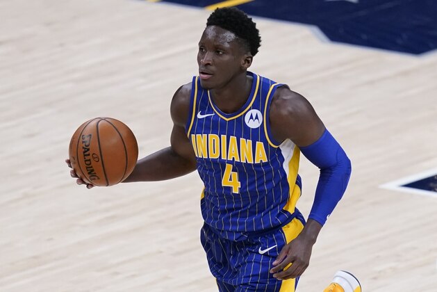 Indiana Pacers' Victor Oladipo (4) dribbles during the second half of an NBA basketball game against the Phoenix Suns, Saturday, Jan. 9, 2021, in Indianapolis. (AP Photo/Darron Cummings)
