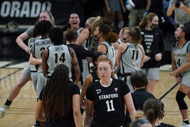 Stanford guard Haley Jones, front left, consoles Stanford forward Ashten Prechtel, front right, as Colorado players celebrate after overtime of an NCAA college basketball game Sunday, Jan. 17, 2021, in Boulder, Colo. (AP Photo/David Zalubowski)
