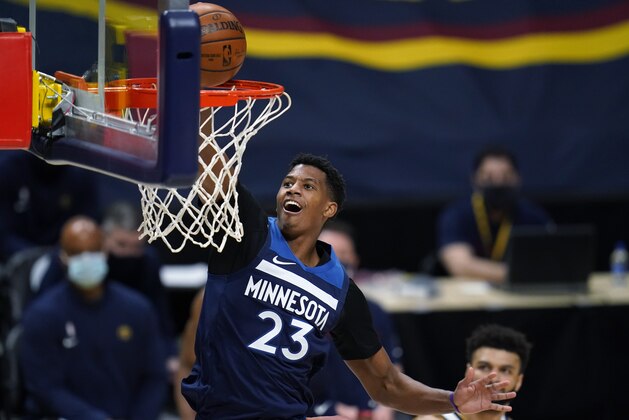Minnesota Timberwolves guard Jarrett Culver scores against the Denver Nuggets during the second half of an NBA basketball game Tuesday, Jan. 5, 2021, in Denver. (AP Photo/David Zalubowski)