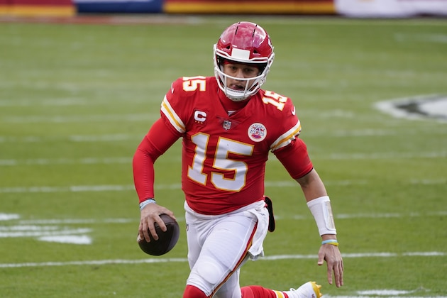 Kansas City Chiefs quarterback Patrick Mahomes runs during the first half of an NFL divisional round football game against the Cleveland Browns, Sunday, Jan. 17, 2021, in Kansas City. (AP Photo/Charlie Riedel)