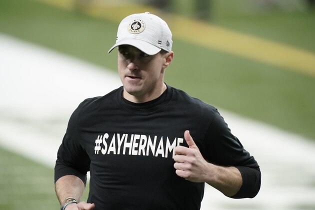 New Orleans Saints quarterback Drew Brees warms up before the first half of an NFL divisional round playoff football game against the Tampa Bay Buccaneers, Sunday, Jan. 17, 2021, in New Orleans. (AP Photo/Brynn Anderson)