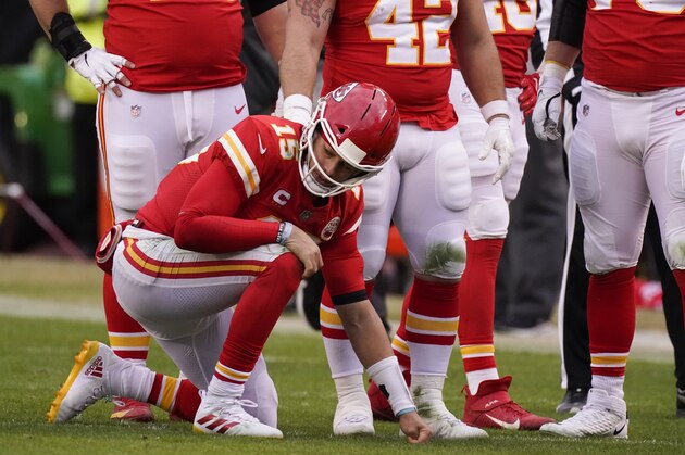 Kansas City Chiefs quarterback Patrick Mahomes kneels on the field after getting injured during the second half of an NFL divisional round football game against the Cleveland Browns, Sunday, Jan. 17, 2021, in Kansas City. (AP Photo/Charlie Riedel)