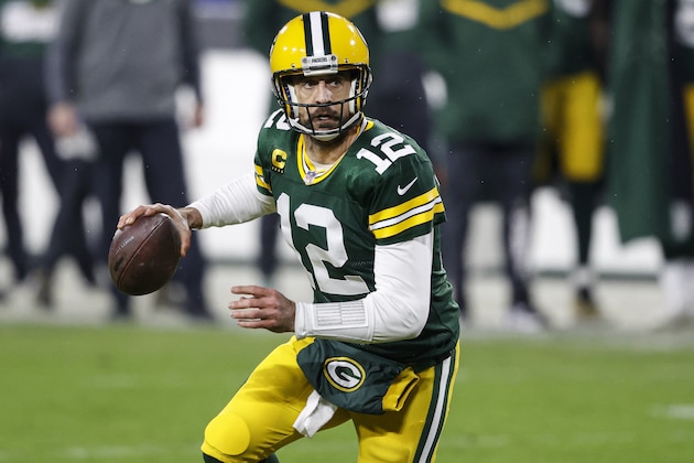 Green Bay Packers quarterback Aaron Rodgers (12) looks to throw during an NFL divisional playoff football game between the Los Angeles Rams and Green Bay Packers, Saturday, Jan. 16, 2021, in Green Bay, Wis. (AP Photo/Jeffrey Phelps)