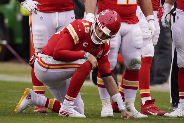 Kansas City Chiefs quarterback Patrick Mahomes kneels on the field after getting injured during the second half of an NFL divisional round football game against the Cleveland Browns, Sunday, Jan. 17, 2021, in Kansas City. (AP Photo/Charlie Riedel)