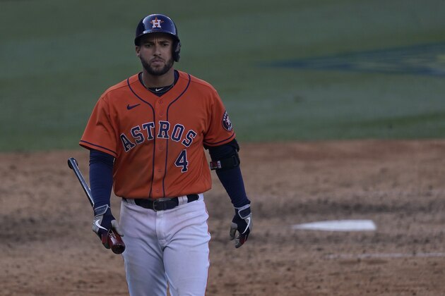Houston Astros' George Springer walks to the dugout after striking out against the Oakland Athletics during the ninth inning of Game 3 of a baseball American League Division Series in Los Angeles, Wednesday, Oct. 7, 2020. (AP Photo/Ashley Landis)