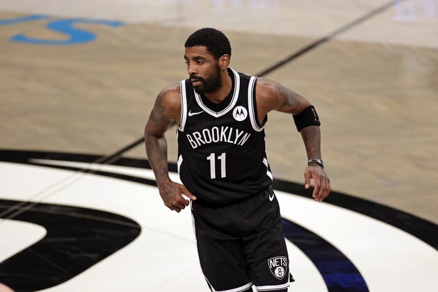 Brooklyn Nets guard Kyrie Irving (11) reacts during an NBA basketball game against the Atlanta Hawks, Friday, Jan. 1, 2021, in New York. The Hawks won 114-96. (AP Photo/Adam Hunger)