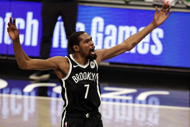 Brooklyn Nets forward Kevin Durant reacts against the Milwaukee Bucks during the first half of an NBA basketball game Monday, Jan. 18, 2021, in New York. (AP Photo/Adam Hunger)