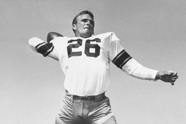 In this 1955 file photo, Jon Arnett of the University of Southern California, is shown in posed action in Los Angeles. Hall of Fame halfback Jon Arnett, one of University of Southern California's greatest running backs who then starred with the Los Angeles Rams, died on Saturday, Jan. 16, 2021, of heart failure in Lake Oswego, Ore. He was 85. (AP Photo/File)