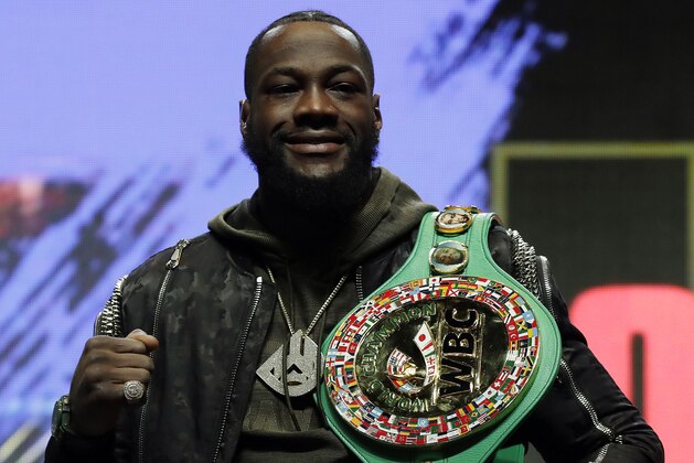 Deontay Wilder poses during a news conference for his upcoming WBC heavyweight championship boxing match against Tyson Fury, of England, Wednesday, Feb. 19, 2020, in Las Vegas. (AP Photo/Isaac Brekken)