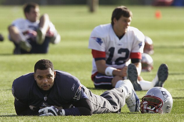 New England Patriots defensive lineman Richard Seymour (93) lays on his stomach while stretching before football practice begins  at the team's training facility in Foxborough, Mass., Wednesday afternoon, Nov. 14, 2007. The Patriots play the Buffalo Bills in Buffalo on Sunday, Nov., 18, 2007. (AP Photo/Stephan Savoia)