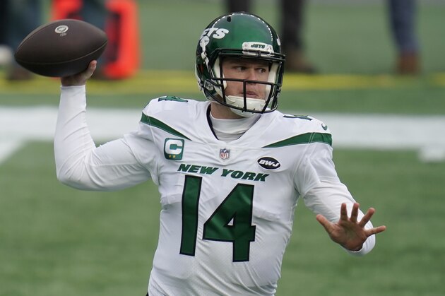 New York Jets quarterback Sam Darnold rolls out to pass against the New England Patriots in the first half of an NFL football game, Sunday, Jan. 3, 2021, in Foxborough, Mass. (AP Photo/Charles Krupa)